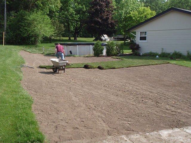 Bob's Grading sodding a freshly graded lawn.